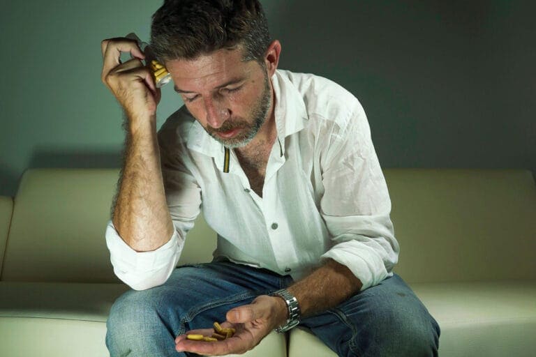 man leaning on hand considers benzodiazepine side effects